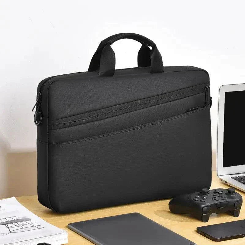 Elegant black business laptop bag for 15.6-17.3 inch laptops on an office desk.